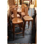 A SET OF 4 MODERN COPPER COLOURED BAR STOOLS WITH BACKS