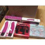 A BOX OF SEX TOYS AND NIPPLE TASSELS