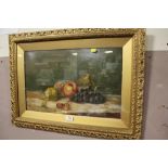 A STILL LIFE OIL DEPICTING FRUIT IN A GILT FRAME S/D