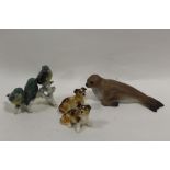 AN AYNSLEY CERAMIC FIGURE OF A SEAL TOGETHER WITH TWO GOEBEL DOG FIGURES PLUS ANOTHER (4)