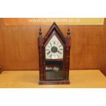 A VINTAGE STEEPLE CLOCK WITH HAND PAINTED DECORATION TO GLASS PANEL