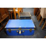 A BLUE PACKING TRUNK AND A SMALLER BLACK TRUNK (2)