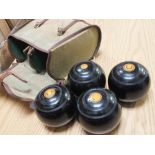 FOUR VINTAGE LAWN BOWLS