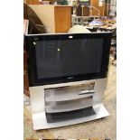 A PANASONIC BRAVIA 37" FLATSCREEN TV ON INTEGRATED STAND WITH REMOTE H/C