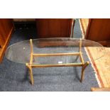 A RETRO TEAK FRAMED GLASS TOP TABLE A/F