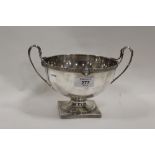 A HALLMARKED SILVER TWIN HANDLED FOOTED BOWL