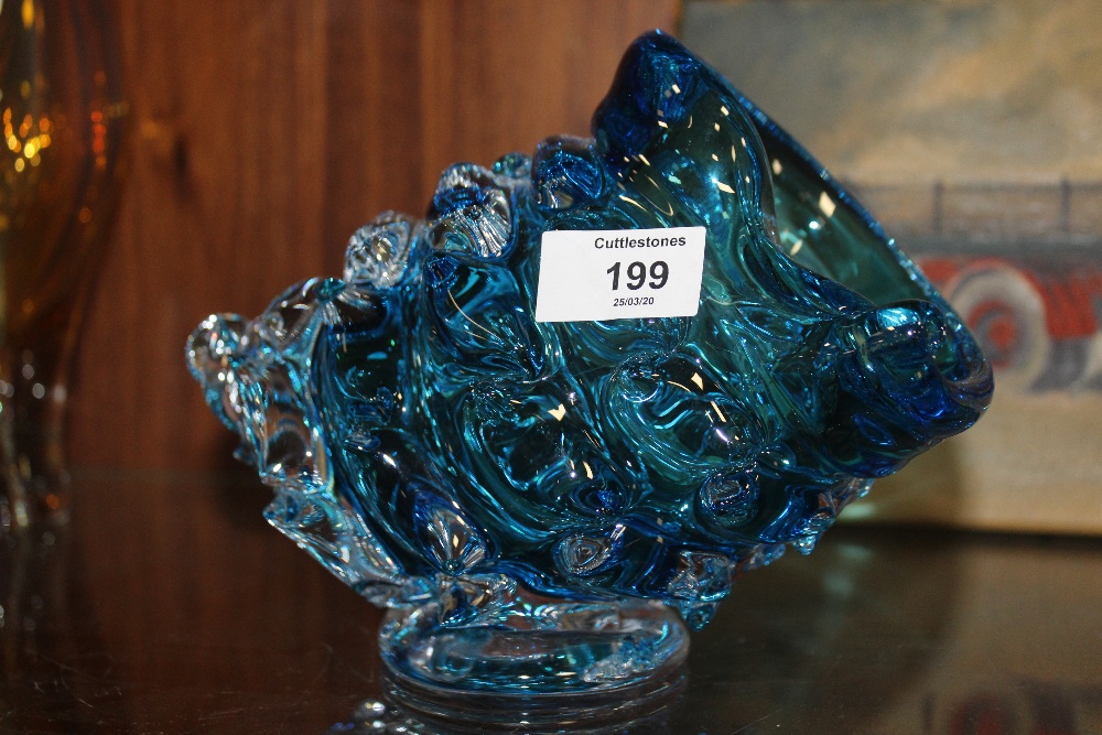 A MODERNIST STYLE BLUE ART GLASS BASE IN THE FORM OF A SHELL