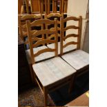 A SET OF FOUR PINE DUCAL DINING CHAIRS