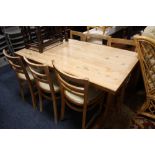 A PINE KITCHEN TRESTLE TABLE AND SIX CHAIRS