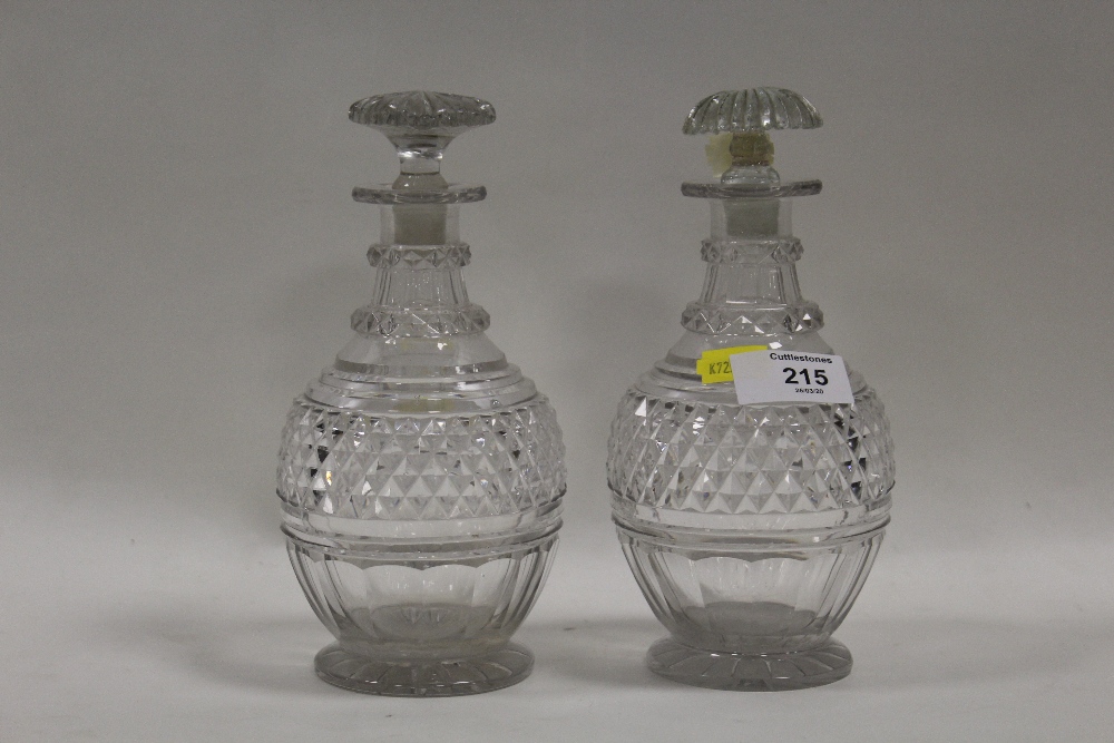 A PAIR OF VINTAGE SMALL CUT GLASS DECANTERSCondition Report:Crack to one stopper, chip to the