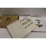 A STAMP COLLECTORS STOCK BOOK, A GREAT BRITAIN STAMP BOOK AND A BOX OF FIRST DAY COVERS
