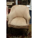 A VINTAGE UPHOLSTERED TUB ARMCHAIR