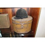 A VINTAGE METAL HAT BOX WITH RIDING HAT