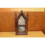 A VINTAGE STEEPLE CLOCK WITH PAINTED DECORATION TO GLASS PANEL