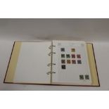 AN EARLY TO MID 20TH CENTURY GERMAN AND TERRITORIES STAMP COLLECTION IN AN ALBUM
