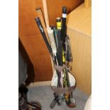 A COLLECTION OF SPORTING ITEMS TO INC GOLF CLUBS AND A SHOOTING STICK
