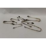 SEVEN PAIRS OF HALLMARKED SILVER SUGAR TONGS TO INC BRIGHTCUT GEORGIAN EXAMPLE AND A GLASGOW RAT-
