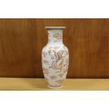 AN ORIENTAL CERAMIC VASE WITH LAMP CONVERSION HOLE TO BASE DECORATED WITH DRAGONS