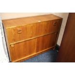 A RETRO TEAK COCKTAIL CABINET WITH INTERIOR FITTINGS