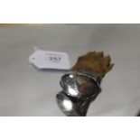 A VICTORIAN MOUNTED OTTER PAW BROOCH DATED 1894, the end being engraved HOH Engleton Mill 25lbs 3