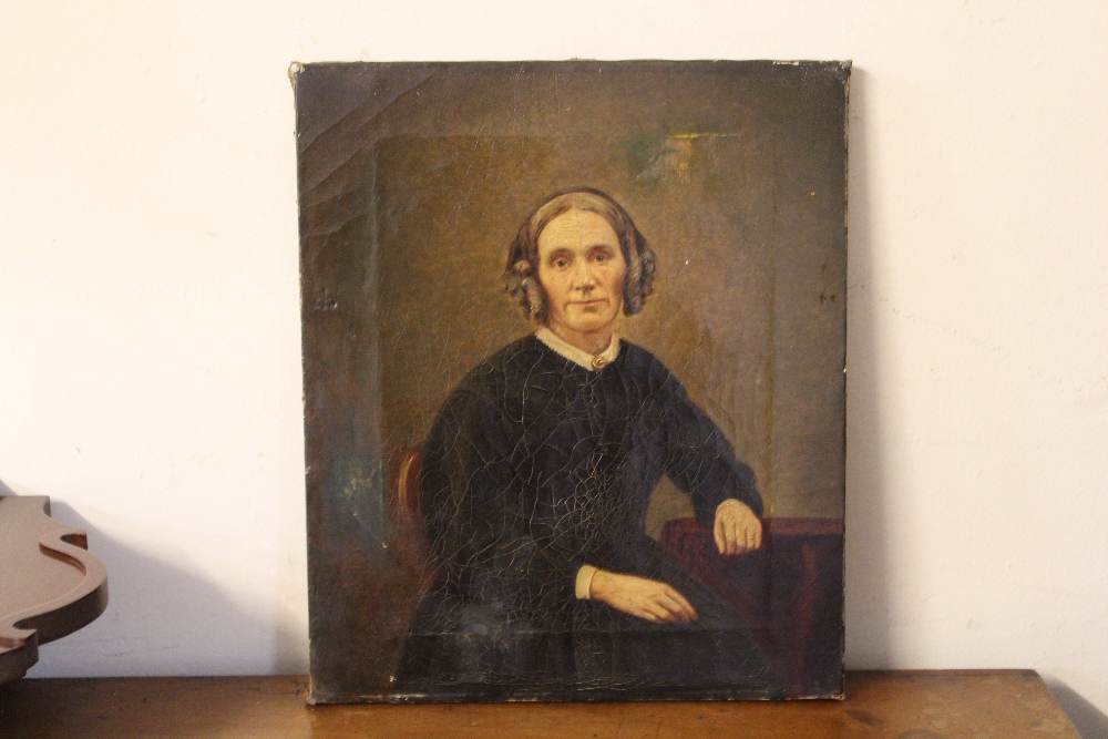 AN UNFRAMED OIL ON CANVAS PORTRAIT OF A SEATED LADY Condition Report:30 x 35 cm