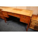 AN ORIENTAL STYLE HARDWOOD DESK WITH FIVE DRAWERS - FADED TOP H-79 CM W-138 CM