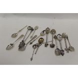 A BAG OF ASSORTED SILVER AND WHITE METAL TEASPOONS