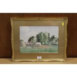 A FRAMED AND GLAZED WATERCOLOUR LAID ON BOARD OF A FARMYARD SCENE INDISTINCTLY SIGNED LOWER RIGHT