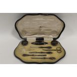 A CASED MAPPIN & WEBB HALLMARKED SILVER AND TORTOISESHELL MANICURE SET - BIRMINGHAM 1915, with pique