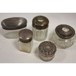 A COLLECTION OF SILVER LIDDED VANITY JARS, various dates and makers, to include a lidded salts jar