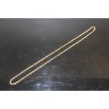 A HALLMARKED 9 CARAT GOLD CHAIN weight - 9.9G APPROX