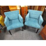 A PAIR OF MODERN UPHOLSTERED TEAL COLOURED ARMCHAIRS