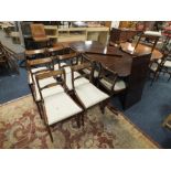 A GOOD QUALITY MAHOGANY EXTENDING TWIN PEDESTAL DINING TABLE WITH TWO ADDITIONAL LEAVES AND 12