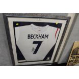 A FRAMED AND GLAZED SIGNED DAVID BECKHAM ENGLAND TEAM FOOTBALL SHIRT 90CM X 76.5CM