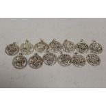 A BAG OF STERLING SILVER SIGNS OF THE ZODIAC PENDANTS