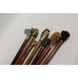 A COLLECTION OF SEVEN ANIMAL HEAD POMMEL WALKING CANES