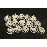 A BAG OF STERLING SILVER SIGNS OF THE ZODIAC PENDANTS