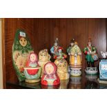 A COLLECTION OF RUSSIAN DOLLS AND RUSSIAN CERAMIC FIGURES (9)