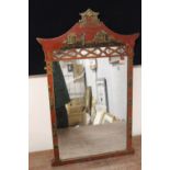 AN ORIENTAL CHINOISERIE WALL MIRROR WITH FIGURATIVE DETAIL