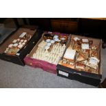 TWO TRAYS OF COTTAGE SHAPED CERAMIC TEA WARE together with a tray of Lurpak toast racks etc (3)