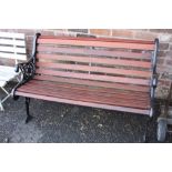 A GARDEN BENCH WITH CAST LEGS