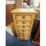 A MODERN COLONIAL STYLE 7 DRAWER TALL CHEST H- 144 CM W- 49 CM