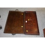 A CARVED OAK TWIN HANDLED SERVING TRAY together with a smaller inlaid example (2)