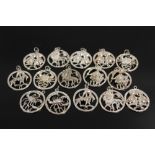 A BAG OF STERLING SILVER SIGNS OF THE ZODIAC PENDANTS