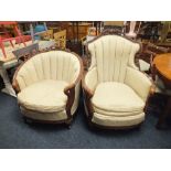 TWO FRENCH UPHOLSTERED ARMCHAIRS WITH CARVED DETAIL