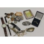 A BAG OF ASSORTED COLLECTABLES to include brooches watches and coins etc.