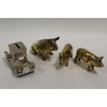 THREE BRASS PIG ORNAMENTS TOGETHER WITH A MONEY BANK IN THE SHAPE OF A CAR (4)
