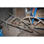 A VINTAGE AGRICULTURAL PLOUGH / SEEDER BY R.HUNT & CO A/F TOGETHER WITH A WHEELBARROW