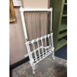 A PAINTED ANTIQUE BRASS AND CAST COT BED WITH SIDES L-144 CM