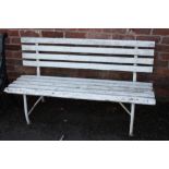 A PAINTED WHITE GARDEN BENCH